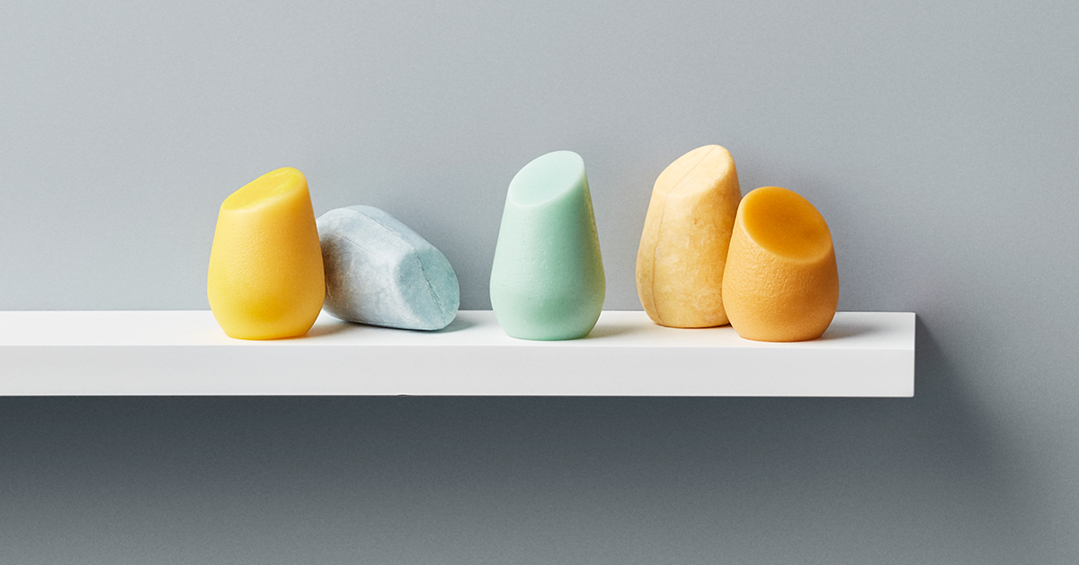 a collection of hibar hair care bars sitting on a shelf