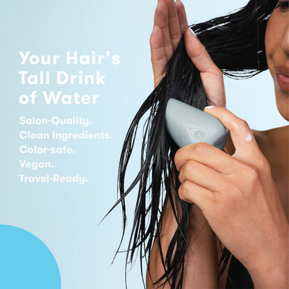 Person using conditioner with text: Your hair's tall drink of water. Salon quality. Clean, vegan formula. Color-safe. Travel-ready.
