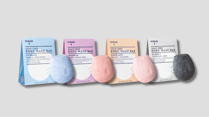 photo of all four HiBAR Body Wash Boxes with bars in front of each box. One Hydrate, Nourish, Exfoliate and Clarify.