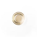 Honeyguat in a glass dish. It is an ivory colored liquid.