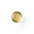 KuKui in a glass dish. It is an ivory colored liquid.