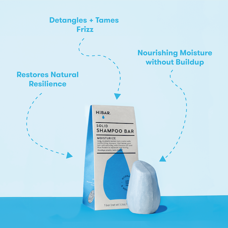 HiBAR solid shampoo bars with packaging on a blue background and product call-outs: deranges + tames frizz. Restores natural resilience. Nourishing moisture without buildup.

