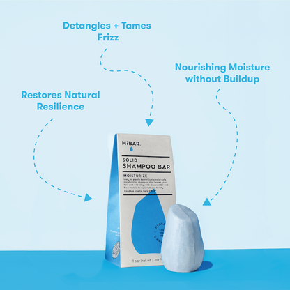 HiBAR solid shampoo bars with packaging on a blue background and product call-outs: deranges + tames frizz. Restores natural resilience. Nourishing moisture without buildup.


