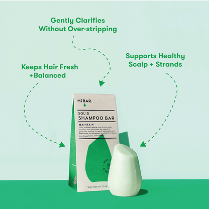 Photo of shampoo bar in front of packaging with product highlights: Gently clarifies without over-stripping. Supports healthy scalp + strands. Keeps hair fresh + balanced.