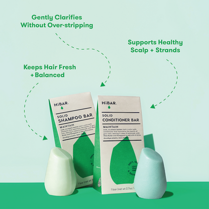 Photo of shampoo bar and conditioner bar in front of packaging with product highlights: Gently clarifies without over-stripping. Supports healthy scalp + strands. Keeps hair fresh + balanced.