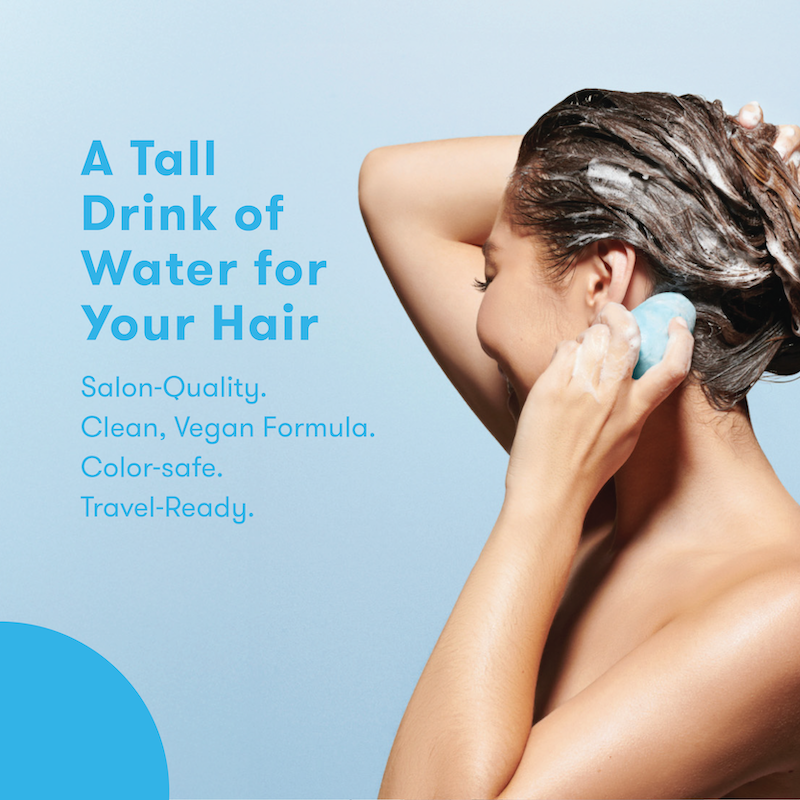 Person using shampoo bar with text with the headline: A Tall Drink of Water for your Hair. Salon-quality, clean, vegan formula, color-safe, and travel-ready product on a blue background.