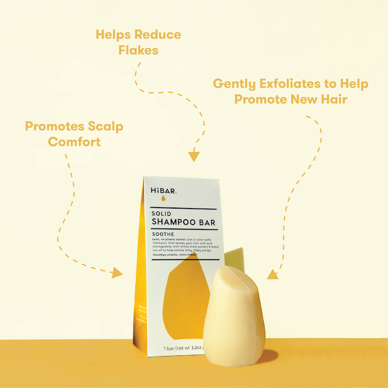 HIBAR solid shampoo bar with packaging on a yellow background with product callouts: Helps reduce flakes. Promotes scalp comfort. Gently exfoliates to help promote new hair.