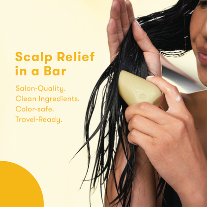 Person using conditioner bar to wash their hair with the words: Scalp Relief in a bar.  Salon-quality. Clean formula. Color-safe. Travel-ready.