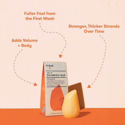 HIBAR solid shampoo bars  with packaging on a peach background with product highlights: Fuller feel from the first wash. More Volume + Body. Stronger, thicker strands over time. 