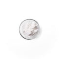 Vitamin_B5 in a glass dish. It is a white colored powder.