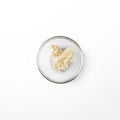 bio gil olive butter in a glass dish. It is a white colored butter-like solid.